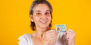 Adult Brazilian woman holding driver's license.
